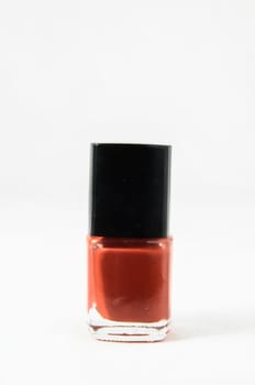 Colorful nail polish brush over white background