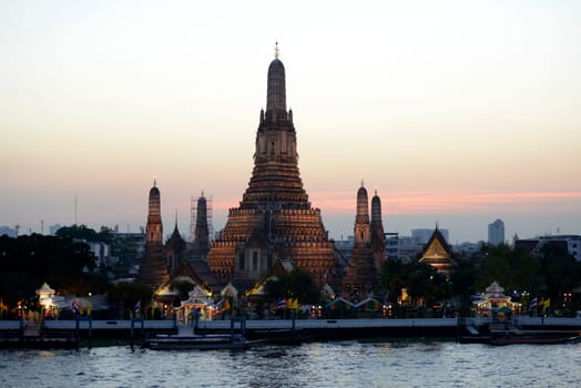 The temple complex of Wat Arun on the Mae Nam Chao Phraya River in the capital Bangkok of Thailand in South East Asia.