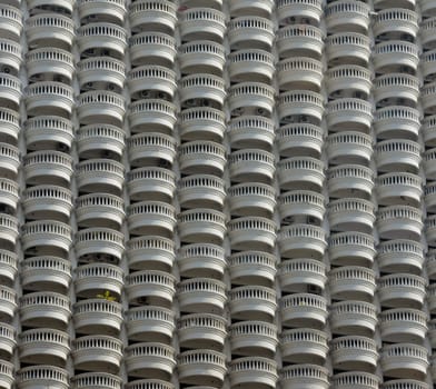 A skyscraper with many balconies on the Mae Nam Chao Phraya River in the capital Bangkok of Thailand in South East Asia.
