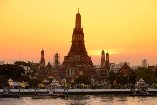 The temple complex of Wat Arun on the Mae Nam Chao Phraya River in the capital Bangkok of Thailand in South East Asia.