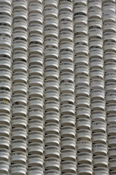 A skyscraper with many balconies on the Mae Nam Chao Phraya River in the capital Bangkok of Thailand in South East Asia.