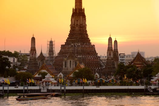 The temple complex of Wat Arun on the Mae Nam Chao Phraya River in the capital Bangkok of Thailand in South East Asia.