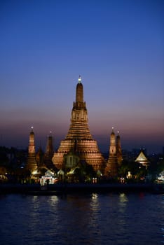 The temple complex of Wat Arun on the Mae Nam Chao Phraya River in the capital Bangkok of Thailand in South East Asia.