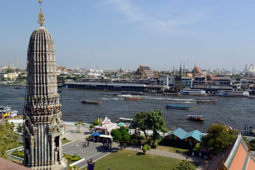 The temple complex of Wat Arun on the Mae Nam Chao Phraya River in the capital Bangkok of Thailand in South East Asia.