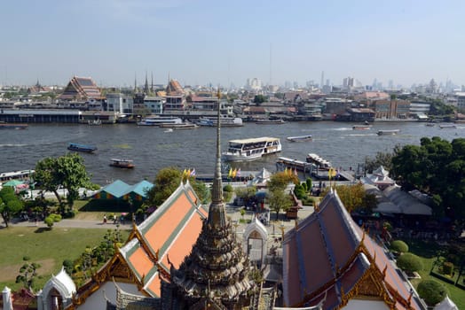 The temple complex of Wat Arun on the Mae Nam Chao Phraya River in the capital Bangkok of Thailand in South East Asia.