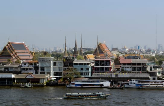 The temple complex of Wat Arun on the Mae Nam Chao Phraya River in the capital Bangkok of Thailand in South East Asia.