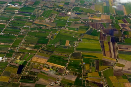 View from a plane on the flight over Chiang Mai in the north of Thailand in South East Asia.