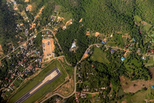View from a plane landing on the village of Mae Hong Son in northern Thailand in South East Asia.