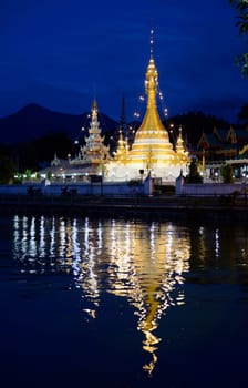 The Wat Jong Kham and Jong Klang temple on Lake Nong Jong Kham in the village of Mae Hong Son in northern Thailand in South East Asia.