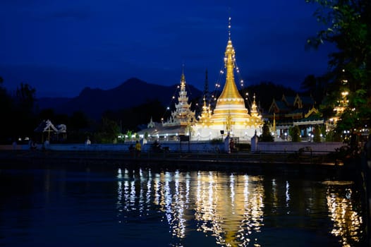 The Wat Jong Kham and Jong Klang temple on Lake Nong Jong Kham in the village of Mae Hong Son in northern Thailand in South East Asia.
