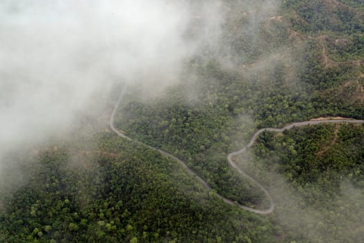 The landscape with the mountain road between Mae Hong on and pai in the mountain oust of Mae Hong Son in the north of Thailand in South East Asia.