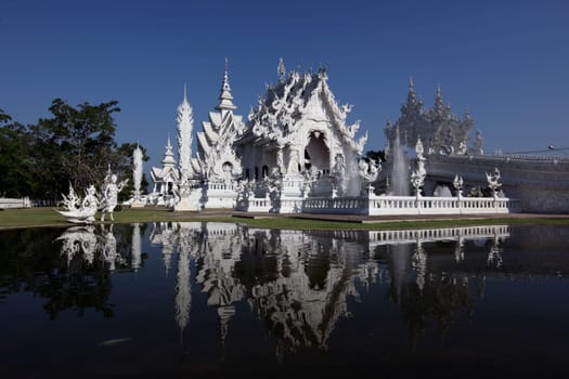 The temple Wat Rong Khun 12 km south of Chiang Rai in the province of chiang Rai in the north of Thailand in South East Asia.