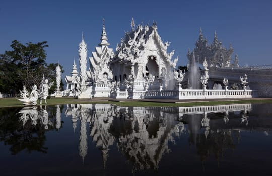 The temple Wat Rong Khun 12 km south of Chiang Rai in the province of chiang Rai in the north of Thailand in South East Asia.