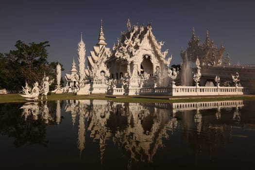 The temple Wat Rong Khun 12 km south of Chiang Rai in the province of chiang Rai in the north of Thailand in South East Asia.