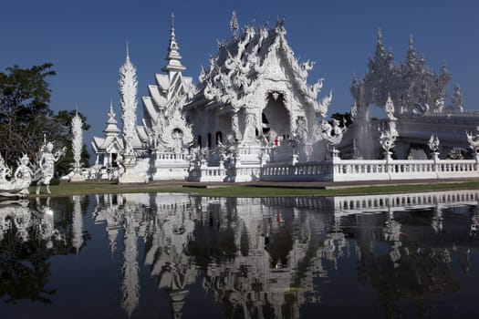 The temple Wat Rong Khun 12 km south of Chiang Rai in the province of chiang Rai in the north of Thailand in South East Asia.