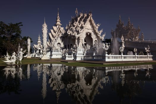 The temple Wat Rong Khun 12 km south of Chiang Rai in the province of chiang Rai in the north of Thailand in South East Asia.