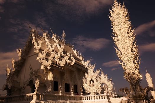 The temple Wat Rong Khun 12 km south of Chiang Rai in the province of chiang Rai in the north of Thailand in South East Asia.