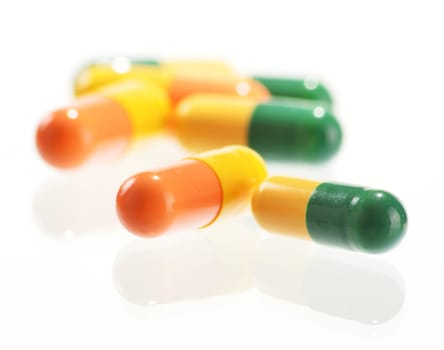 Composition with drug pills isolated on white background