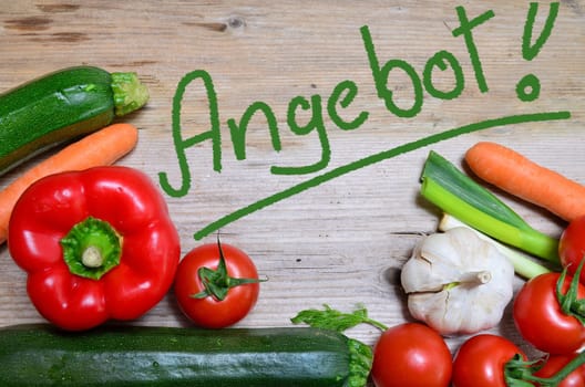 Organic table of fresh vegetables on wooden board