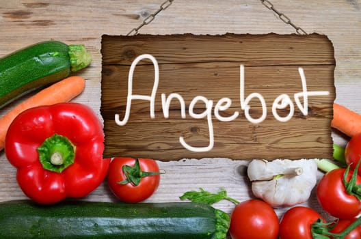 Table of fresh vegetables on wooden board