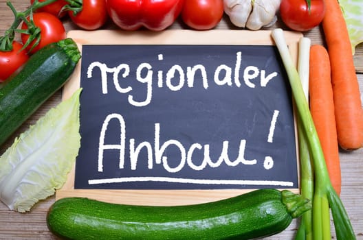 Table of fresh vegetables on wooden board