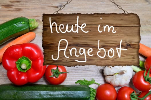 Table of fresh vegetables on wooden board