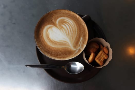 A Cafe Cappucino in a downtown cafe shop around the Siam Square district in central Bangkok,Thailand.