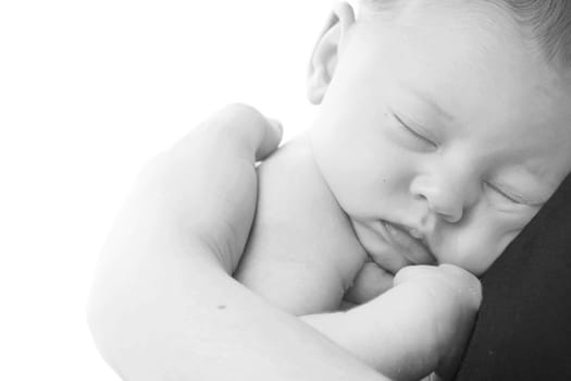 happy newborn baby girl just a week old photographed in the studio