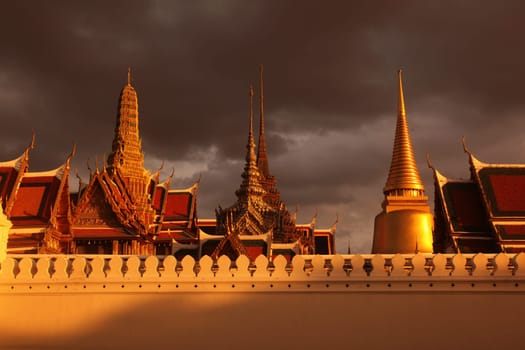 The temple gelaende in the evening atmosphere with Wat Phra Keo at the Royal Palace in the historical center of the capital Bangkok in Thailand.