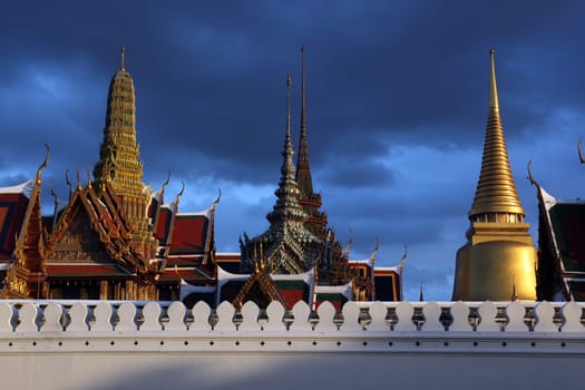 The temple gelaende in the evening atmosphere with Wat Phra Keo at the Royal Palace in the historical center of the capital Bangkok in Thailand.