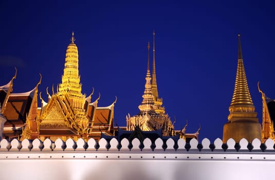 The temple gelaende in the evening atmosphere with Wat Phra Keo at the Royal Palace in the historical center of the capital Bangkok in Thailand.