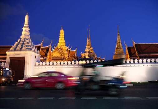 The temple gelaende in the evening atmosphere with Wat Phra Keo at the Royal Palace in the historical center of the capital Bangkok in Thailand.