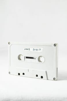 Ancient Vintage Used Musicassette over a White Background