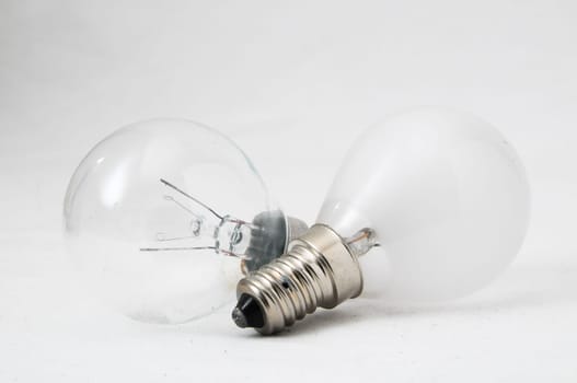 Two Different Old Incandescent Light Bulbs on a White Background