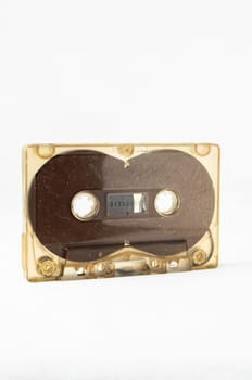 Ancient Vintage Used Musicassette over a White Background
