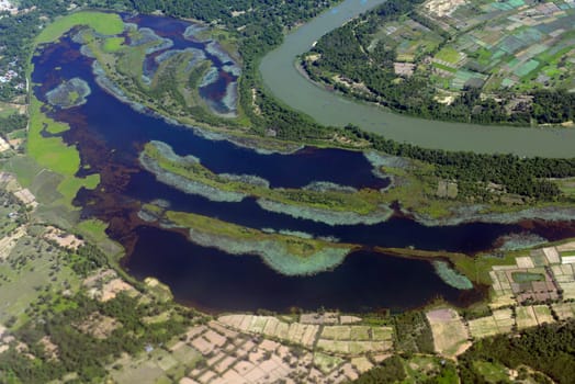 The landscape of an airplane over the surroundings of Ubon Ratchathani in the northeast of Thailand in South East Asia.