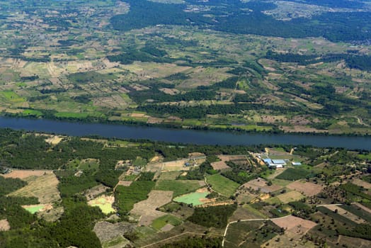 The landscape of an airplane over the surroundings of Ubon Ratchathani in the northeast of Thailand in South East Asia.