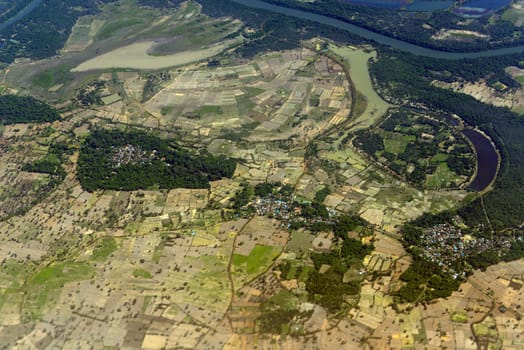 The landscape of an airplane over the surroundings of Ubon Ratchathani in the northeast of Thailand in South East Asia.