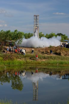 A racket starts at the traditional rocket festival or Bun Bang Fai or Rocket Festival in Ban Si Than in Amnat Charoen province northwest of Ubon Ratchathani in northeastern Thailand in South East Asia.