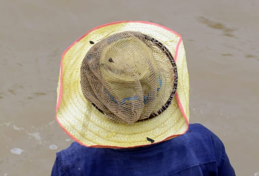 A woman fishing in a river in Amnat Charoen province northwest of Ubon Ratchathani in northeastern Thailand in South East Asia.