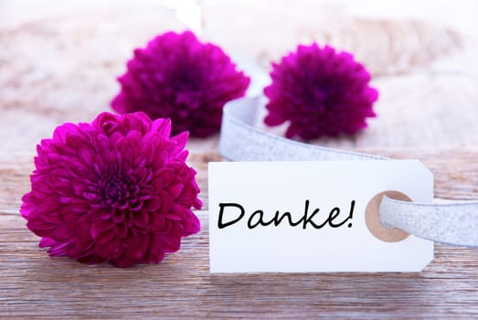 Label with the german word Danke which means Thanks and Purple Flowers