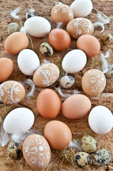 Rustic background with different eggs