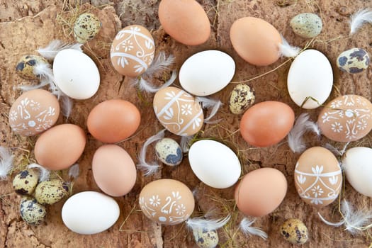 Rustic background with different eggs