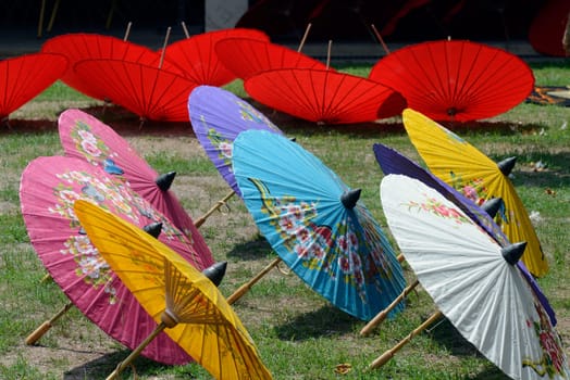 Traditionall umbrellas and faechers from Paier are produced in a paper screen factory in Chiang Mai in the north of Thailand in South East Asia.