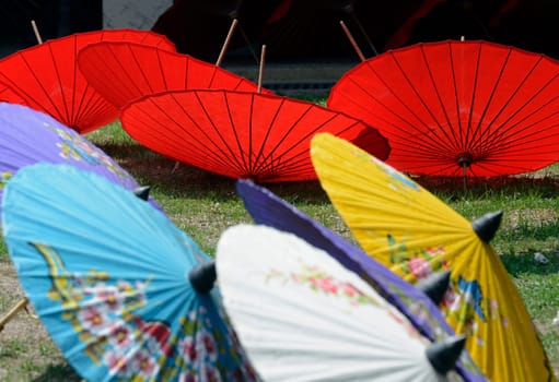 Traditionall umbrellas and faechers from Paier are produced in a paper screen factory in Chiang Mai in the north of Thailand in South East Asia.