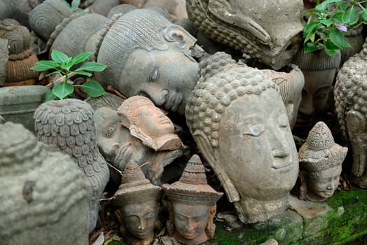 Traditional figures are available for sale in the garden of Ban Phor Linag Meun's Terracota Art at Terracota Garden in Chiang Mai in northern Thailand in South East Asia.