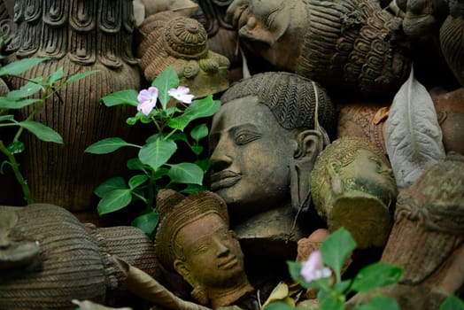Traditional figures are available for sale in the garden of Ban Phor Linag Meun's Terracota Art at Terracota Garden in Chiang Mai in northern Thailand in South East Asia.