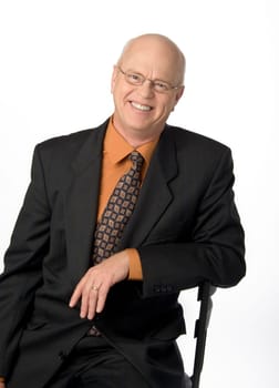 Waist-up photo of mature businessman on white background.
