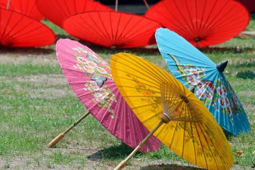 Traditionall umbrellas and faechers from Paier are produced in a paper screen factory in Chiang Mai in the north of Thailand in South East Asia.