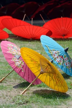 Traditionall umbrellas and faechers from Paier are produced in a paper screen factory in Chiang Mai in the north of Thailand in South East Asia.